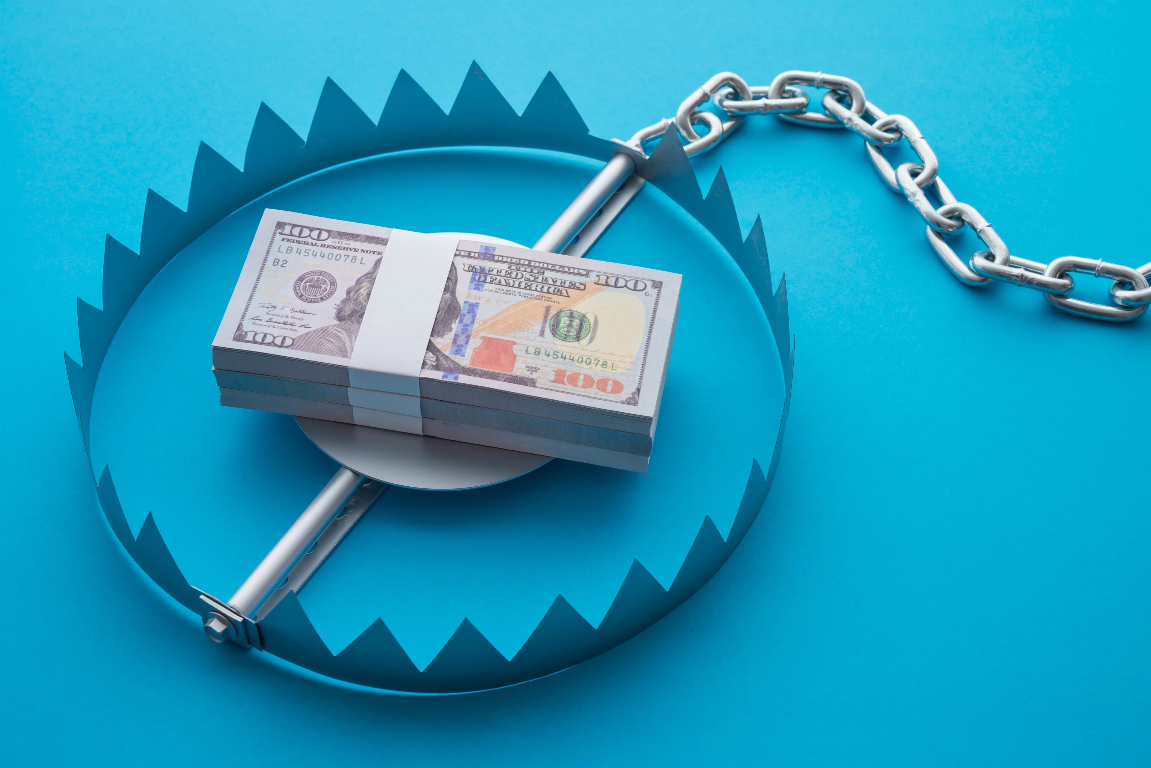 Pile,Of,Money,Dollar,Banknotes,In,A,Bear,Trap,On